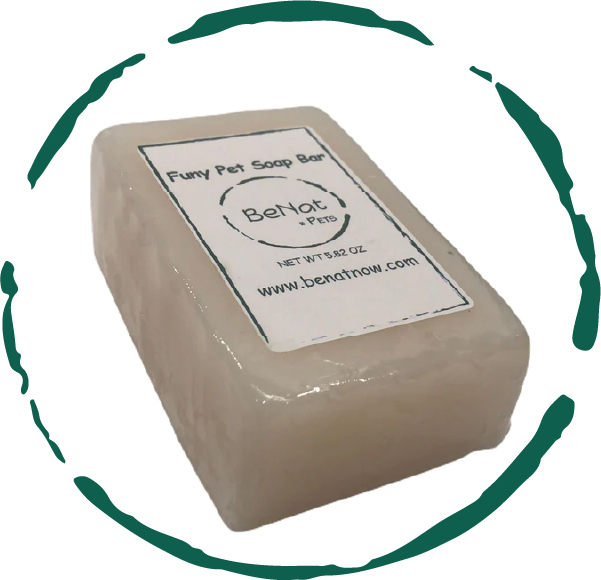 Beige pet soap bar with a label on a white background