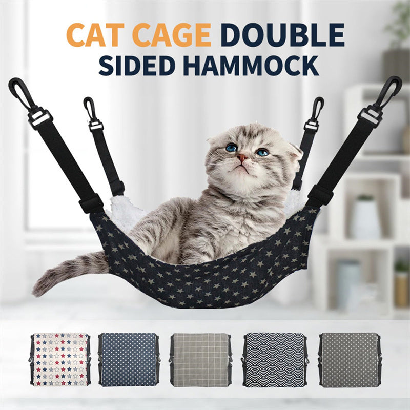 Gray tabby cat relaxing in black star-pattern cat hammock