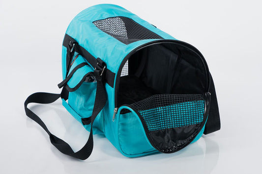 Turquoise pet carrier with black interior on a white background