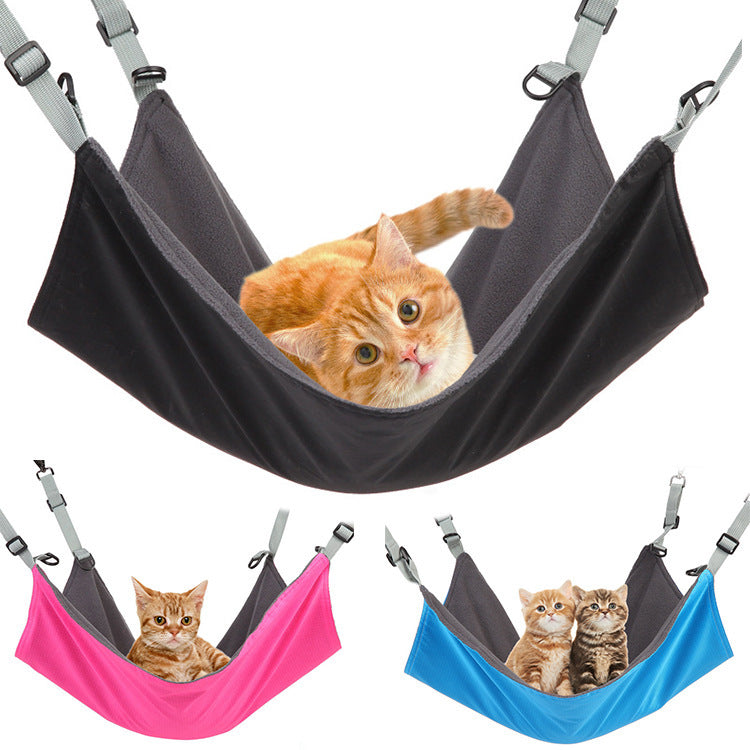 Orange cat resting in black hammock