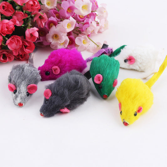 Colorful mouse-shaped toys with pink noses on a white background, surrounded by pink flowers.